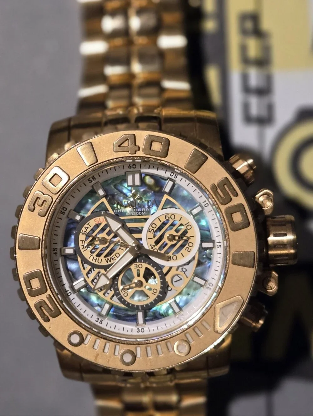 Invicta Gold Chronograph Watch with Mother-of-Pearl Dial